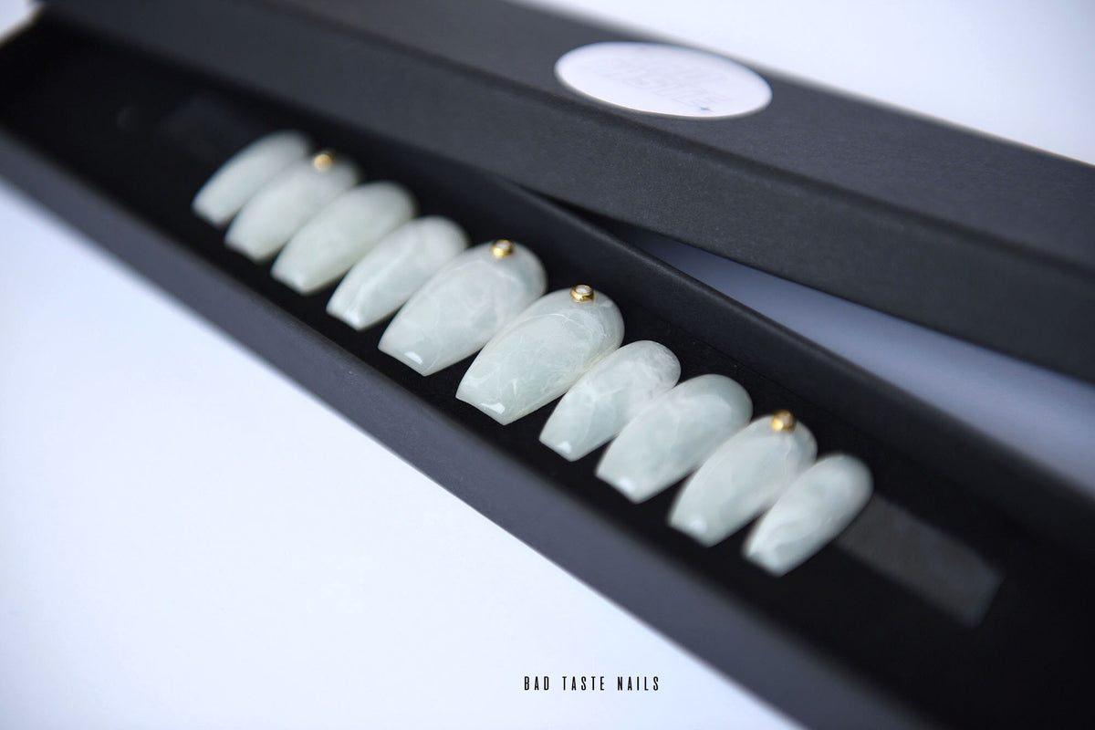 White marble pearl press-on nails with tiny gold accents