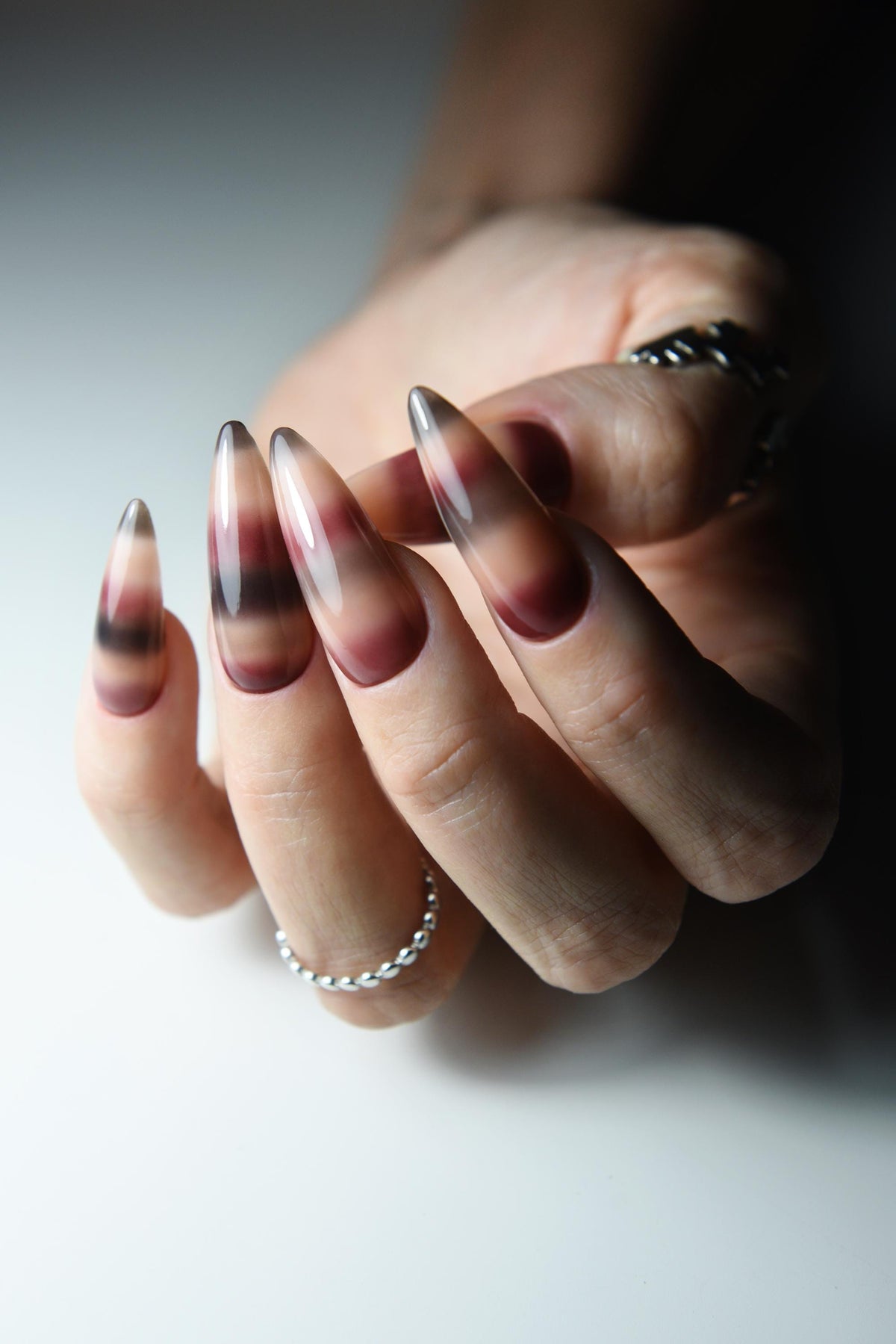 Hand-painted mohair sweater-inspired press-on nails in long almond shape – detail view