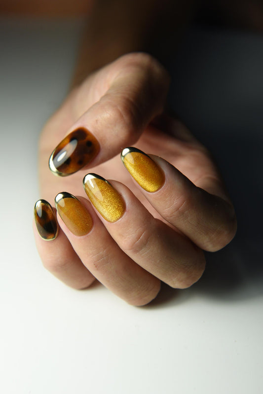 Honey-gold cat-eye press-on nails with tortoise shell accents